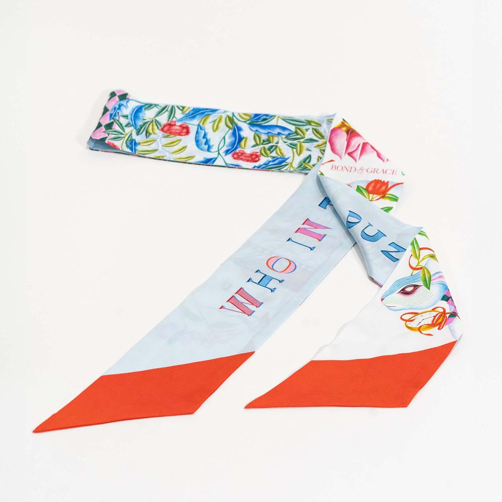 Silk twilly scarf ribbon, light blue with colorful flowers and orange-red accents