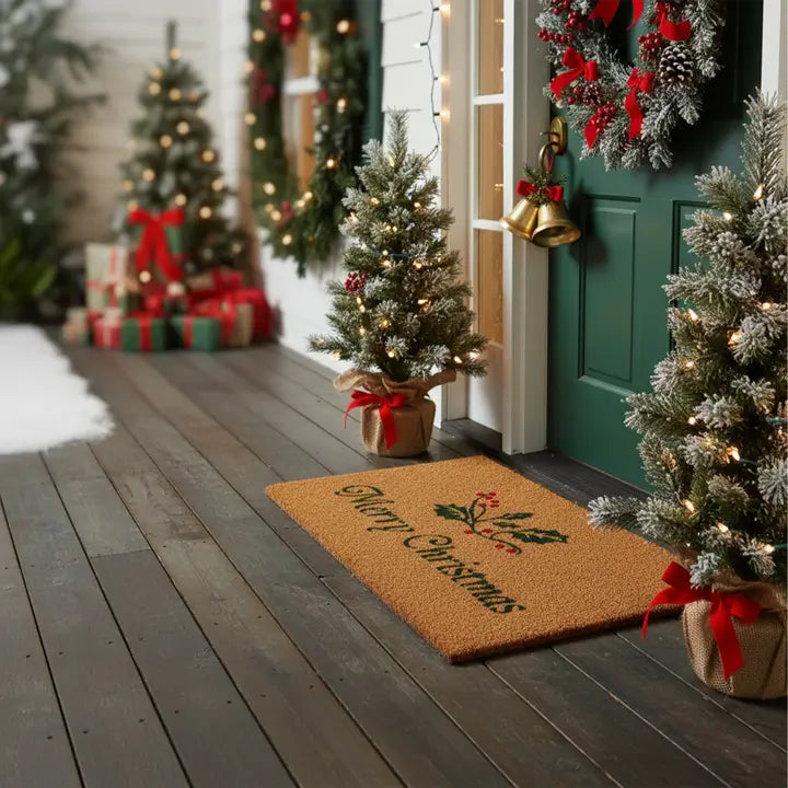 Tan doormat with holly sprig and "Merry Christmas" lettering on doorway
