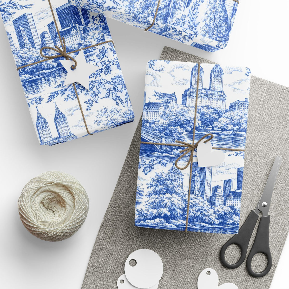 Glossy blue-and-white toile wrapping paper roll with city building pattern