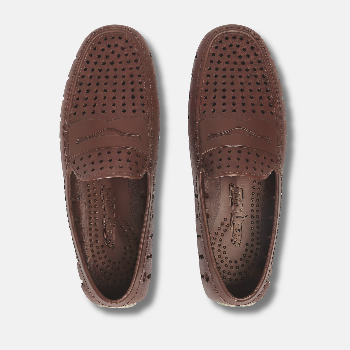Men's brown slip-on loafers, pair view with perforated upper and moc toe