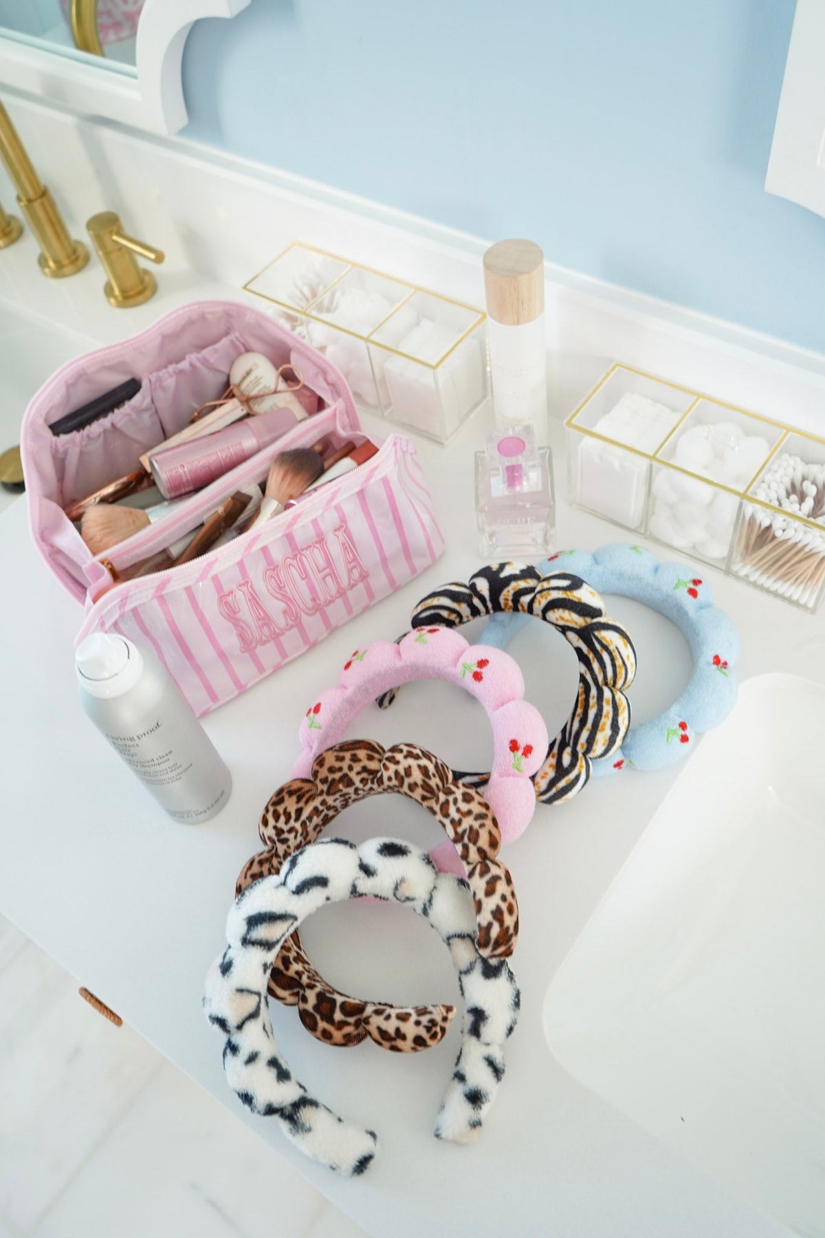 Plush animal-print braided headbands in pink, leopard, zebra, and blue tones