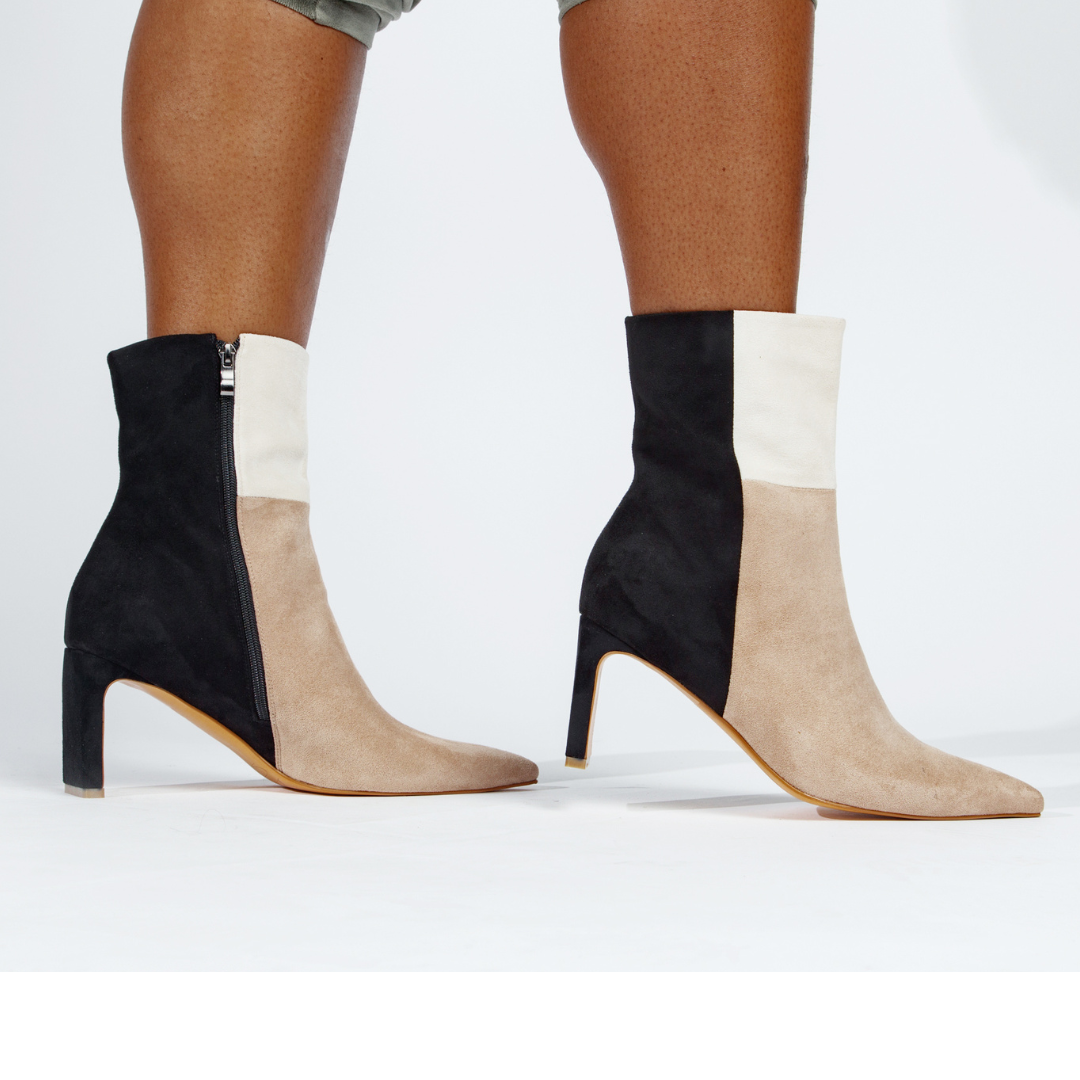 Pair of color-block ankle boots with side zips, nude suede and black upper, high heels