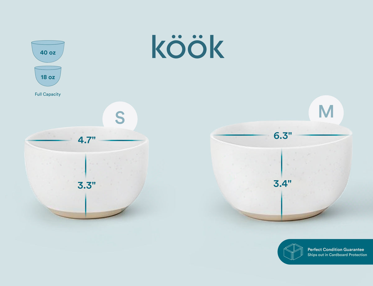 Small and medium speckled off-white ceramic nesting bowls, each with a flared rim