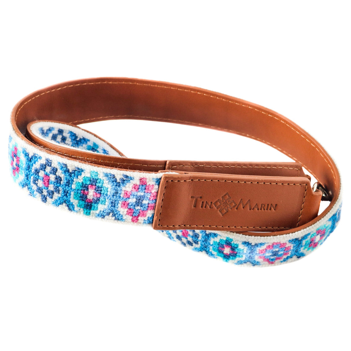Mai woven bag strap with blue/pink embroidery pattern and tan leather connector strip
