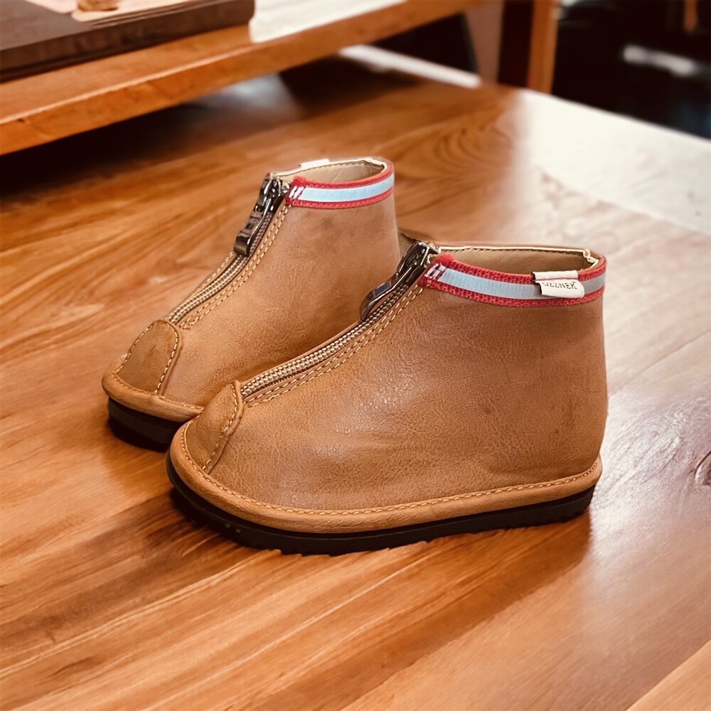 Toddler brown ankle boots with side zipper and red trim, front angled view