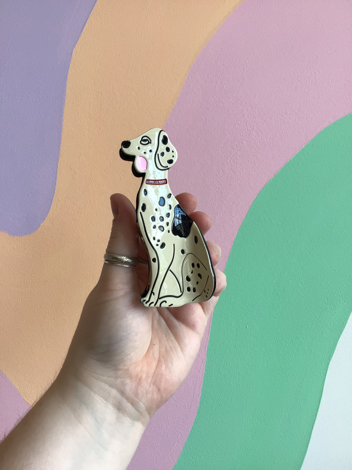 Dalmatian-themed hair claw with white and black spotted dog design