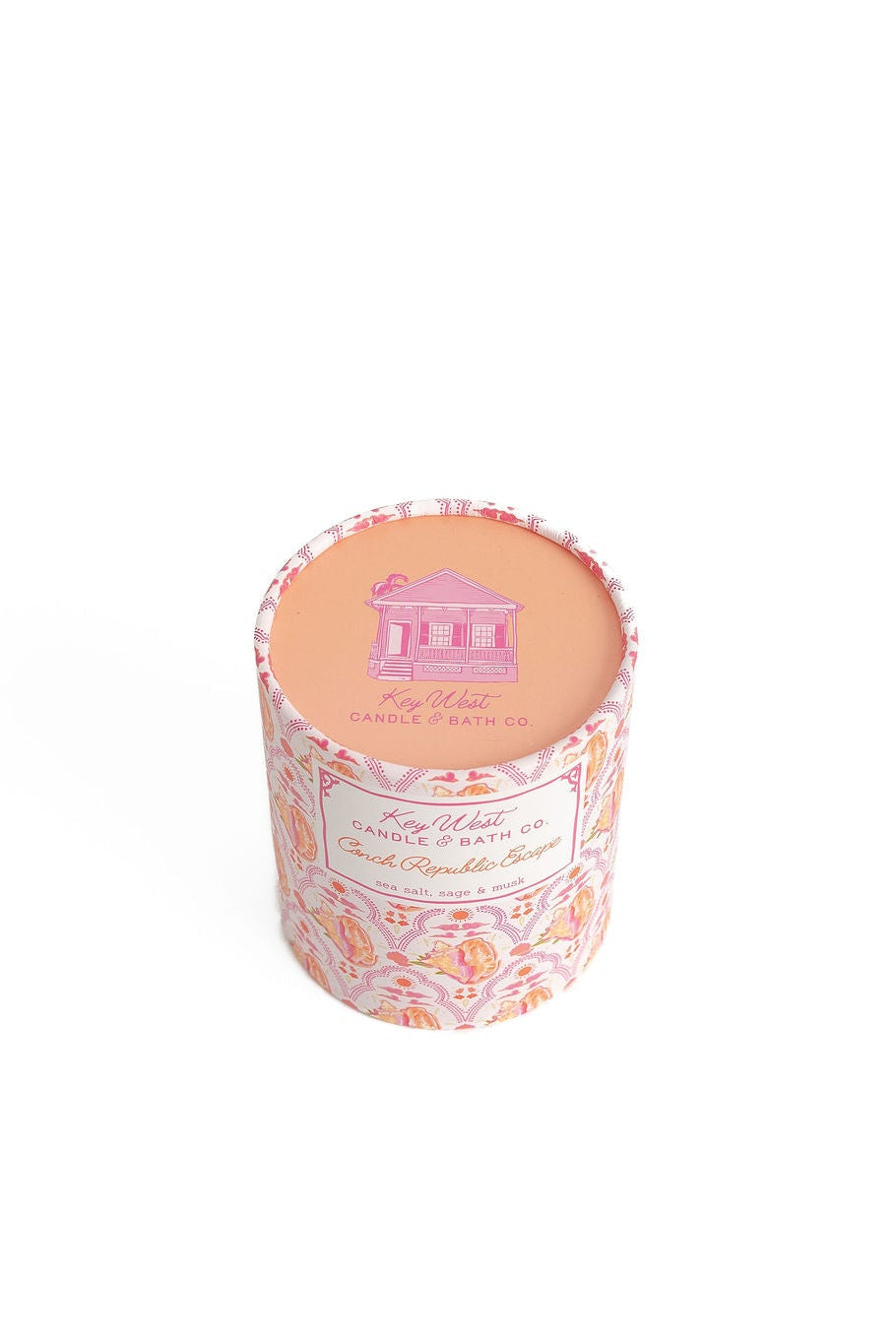 Glass jar candle with pink top insert and colorful patterned label