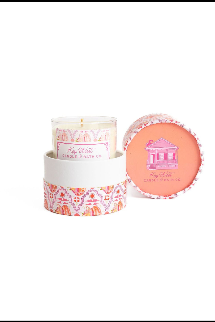 Glass jar candle with matching lid removed, showing pink wax insert