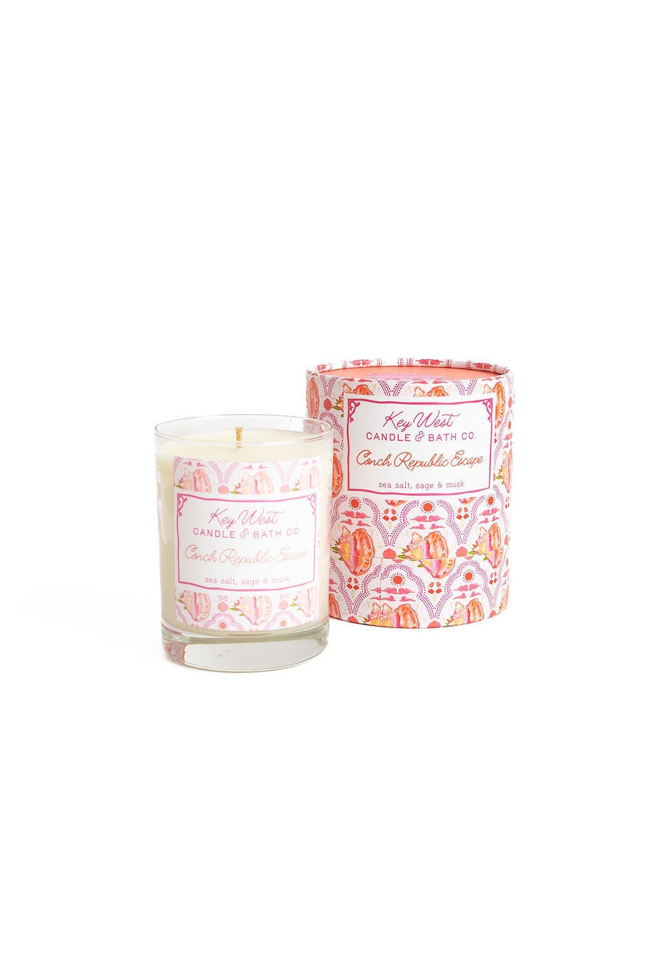 Decorative glass jar candle with pink patterned label and white wax top