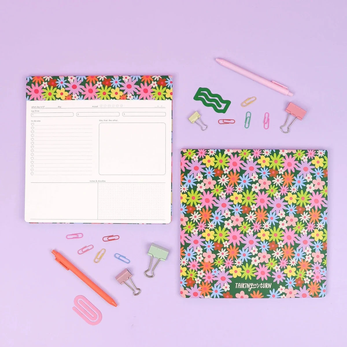 Floral paper notepad with pastel flower pattern cover and ruled pages layout