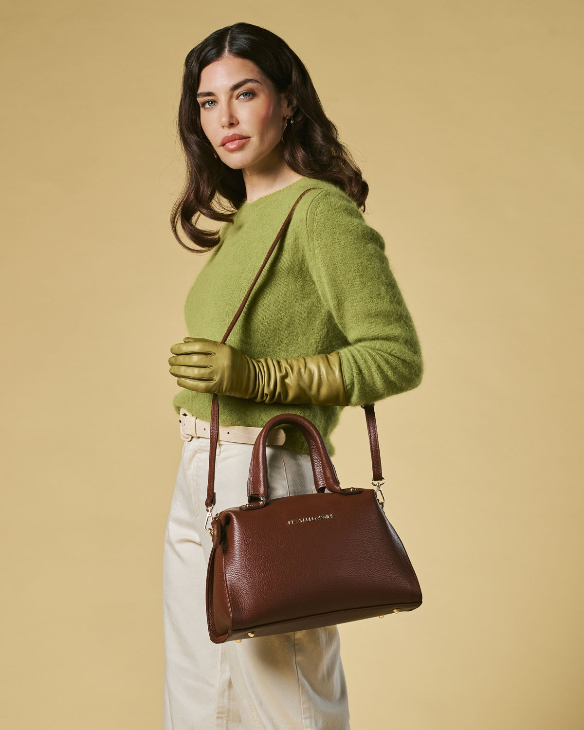 Brown calf leather handbag with shoulder strap and structured zip-top opening