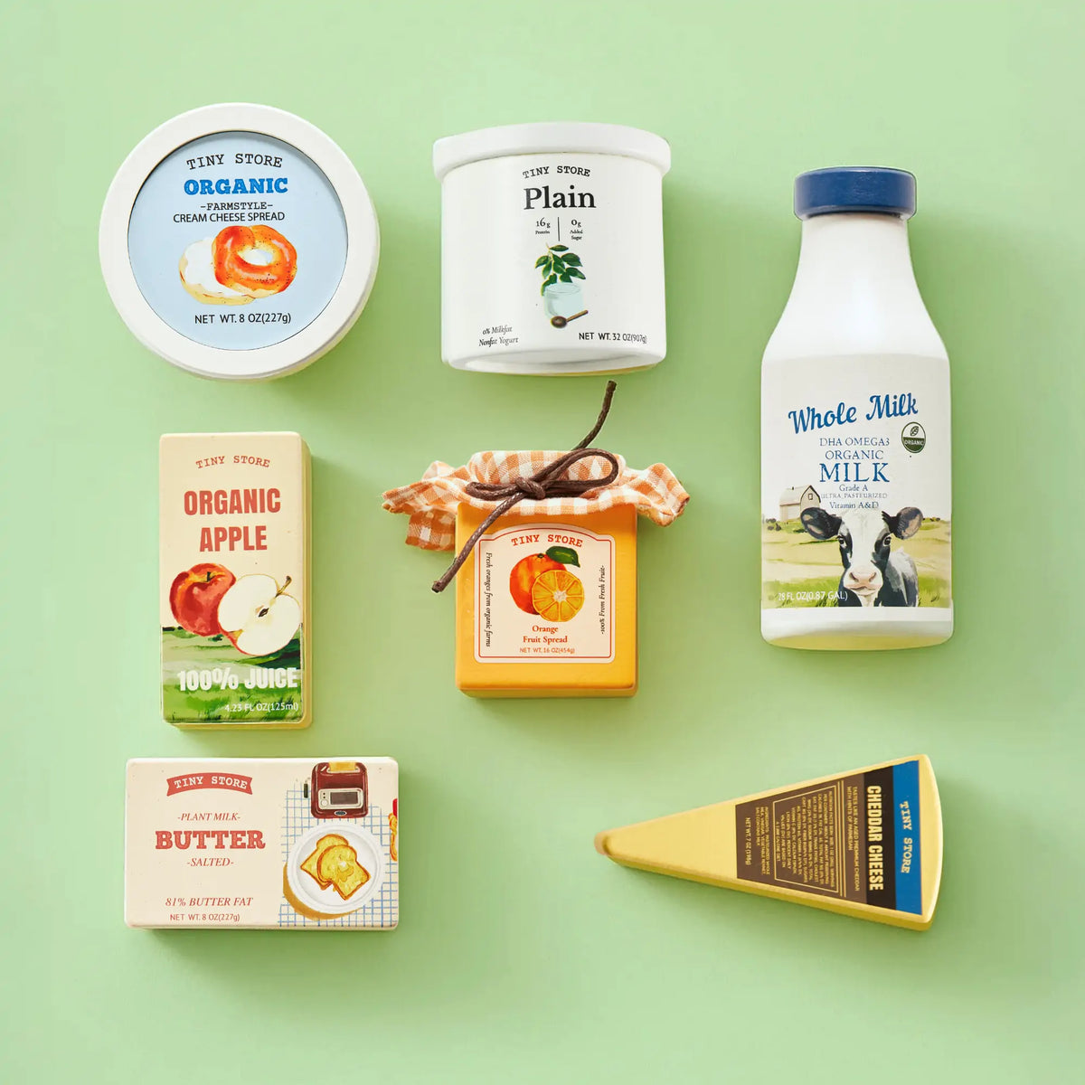 Tiny Land organic dairy play food set with cheese, milk, butter, and apple