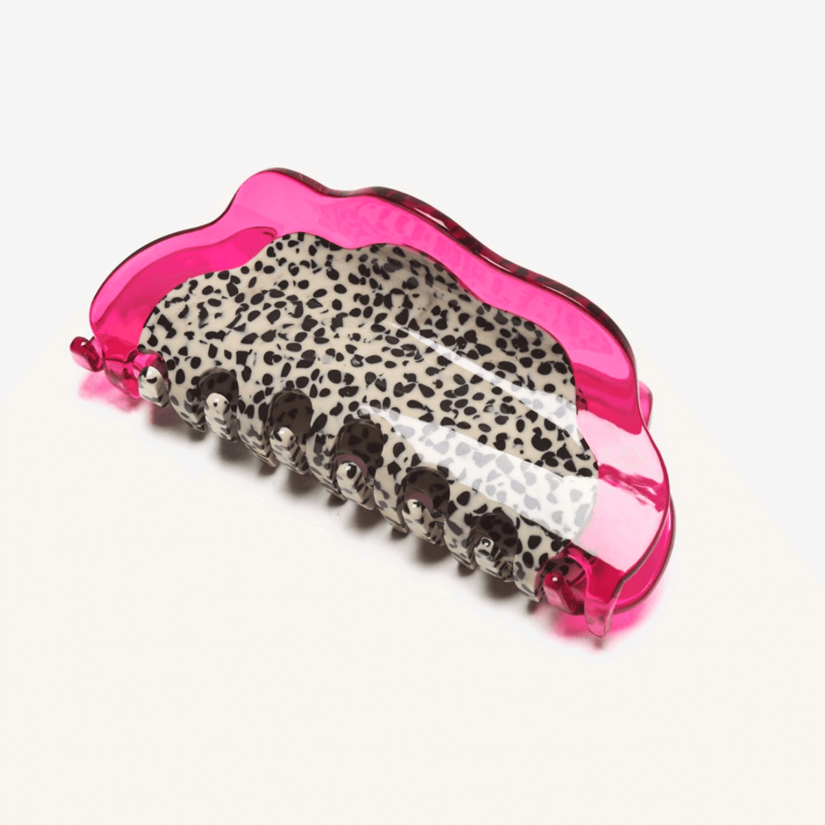 Dragon fruit hair claw with pink translucent frame and leopard-print grip teeth