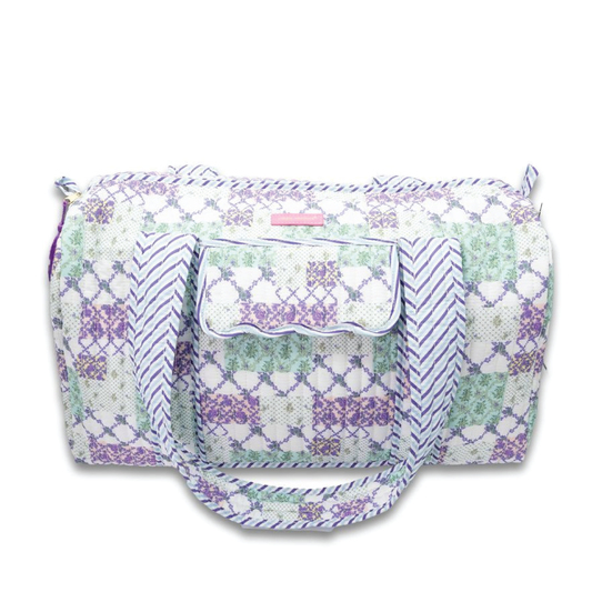 Quilted duffle bag with patchwork pattern, top zipper, and two carry handles