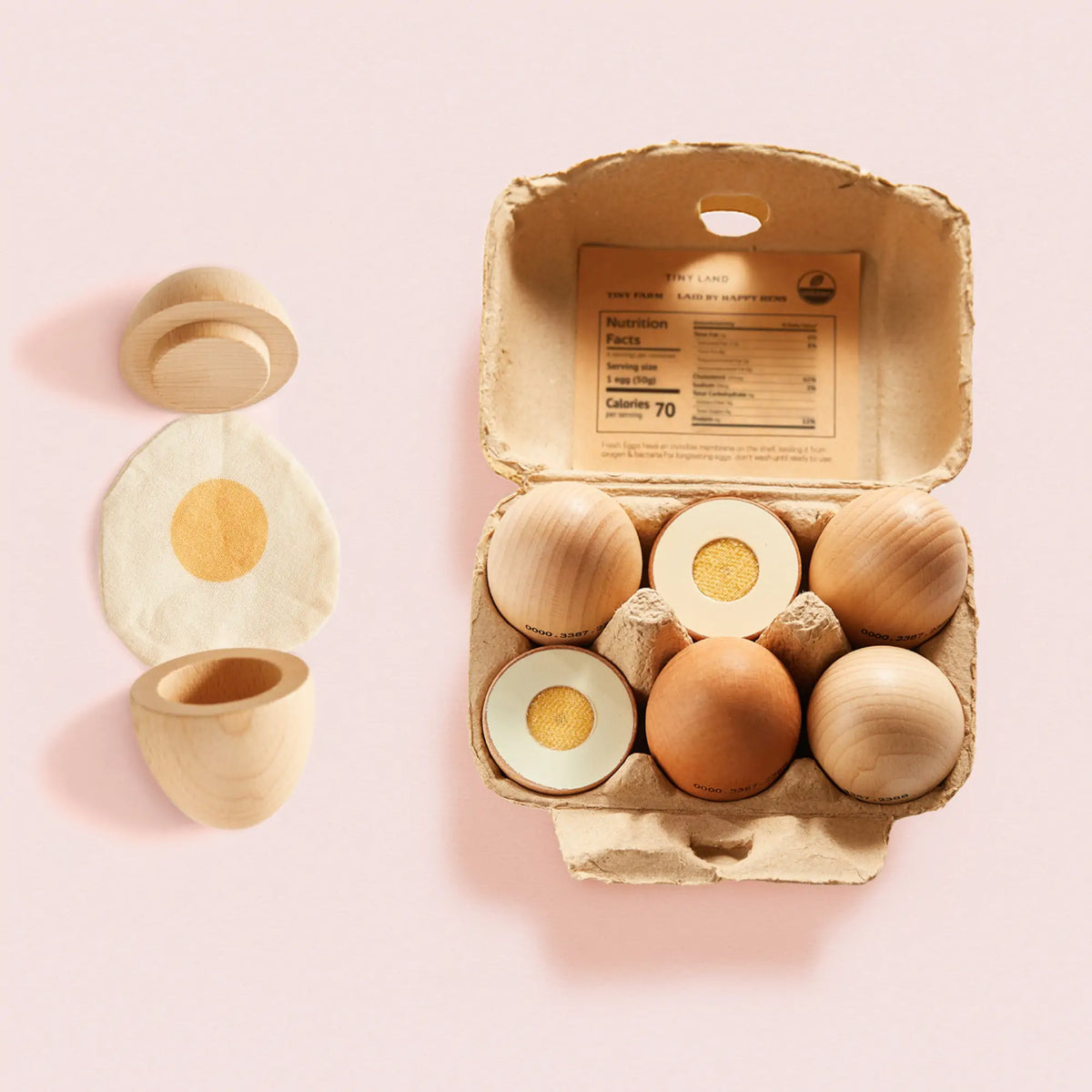 Wooden egg playset with an egg carton, whole eggs, cut eggs, fried egg, and egg cup.