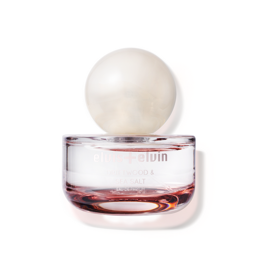Driftwood & Sea Salt eau de parfum bottle with round cap and amber base