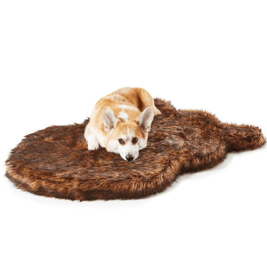 Curved brown faux fur dog bed rug with shag texture, studio view