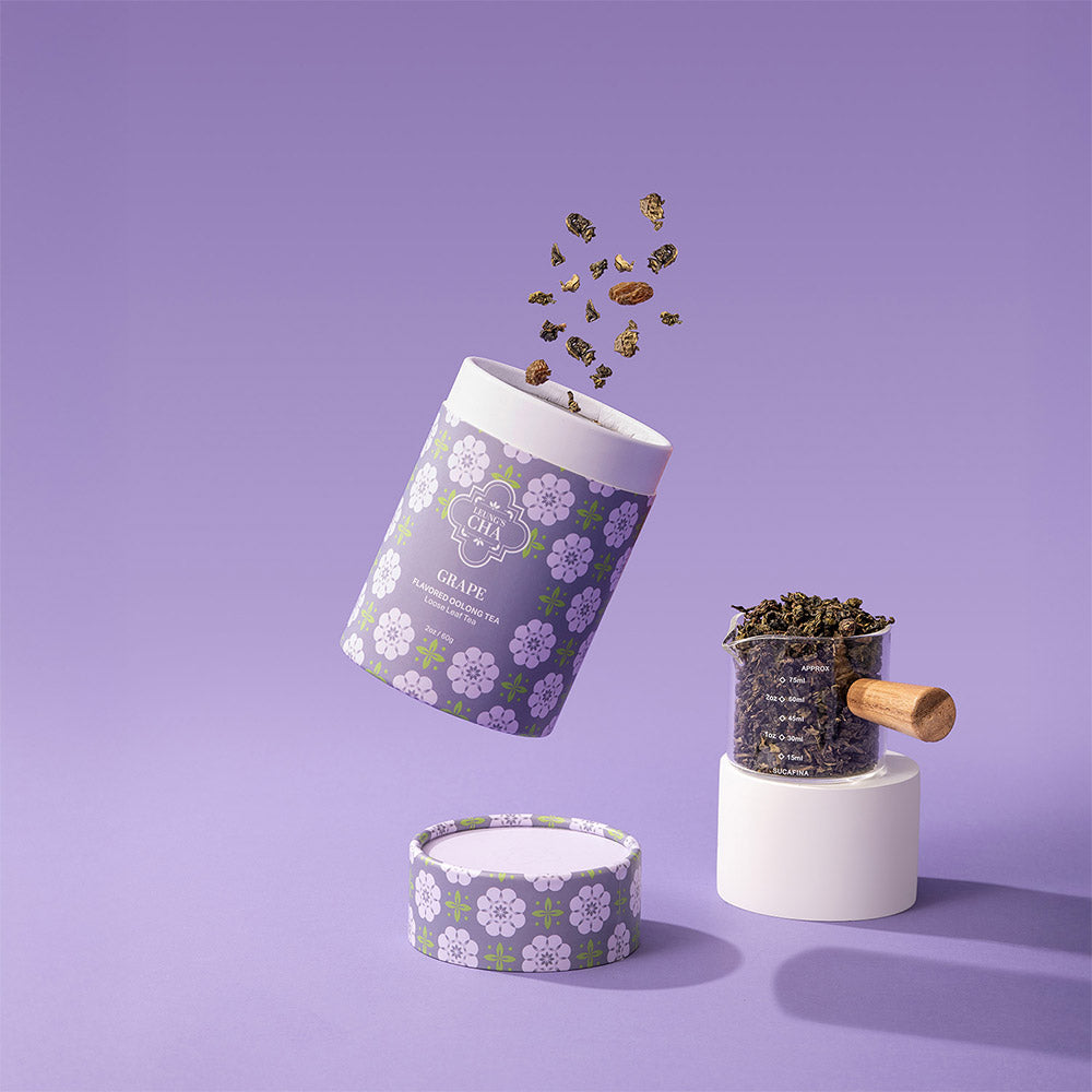 Grape oolong tea canister with floral label and scoop of dried tea leaves