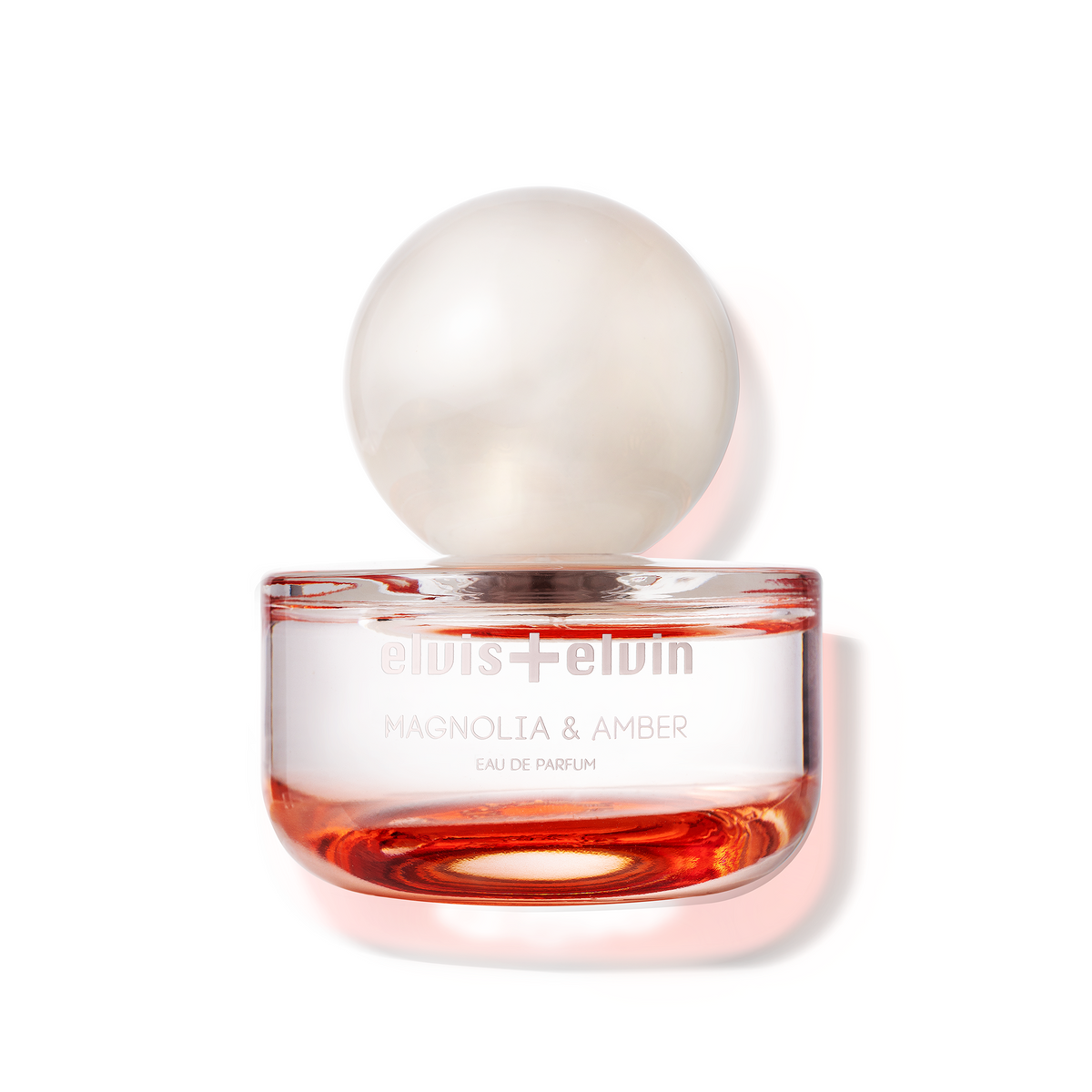 Magnolia & Amber eau de parfum in amber glass jar with clear lid