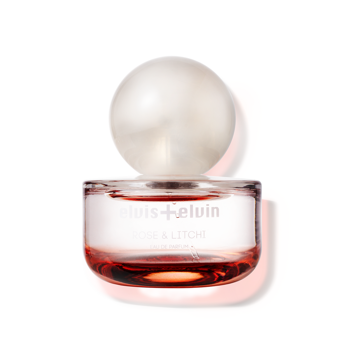 Rose & Litchi eau de parfum bottle with rounded glass dome cap