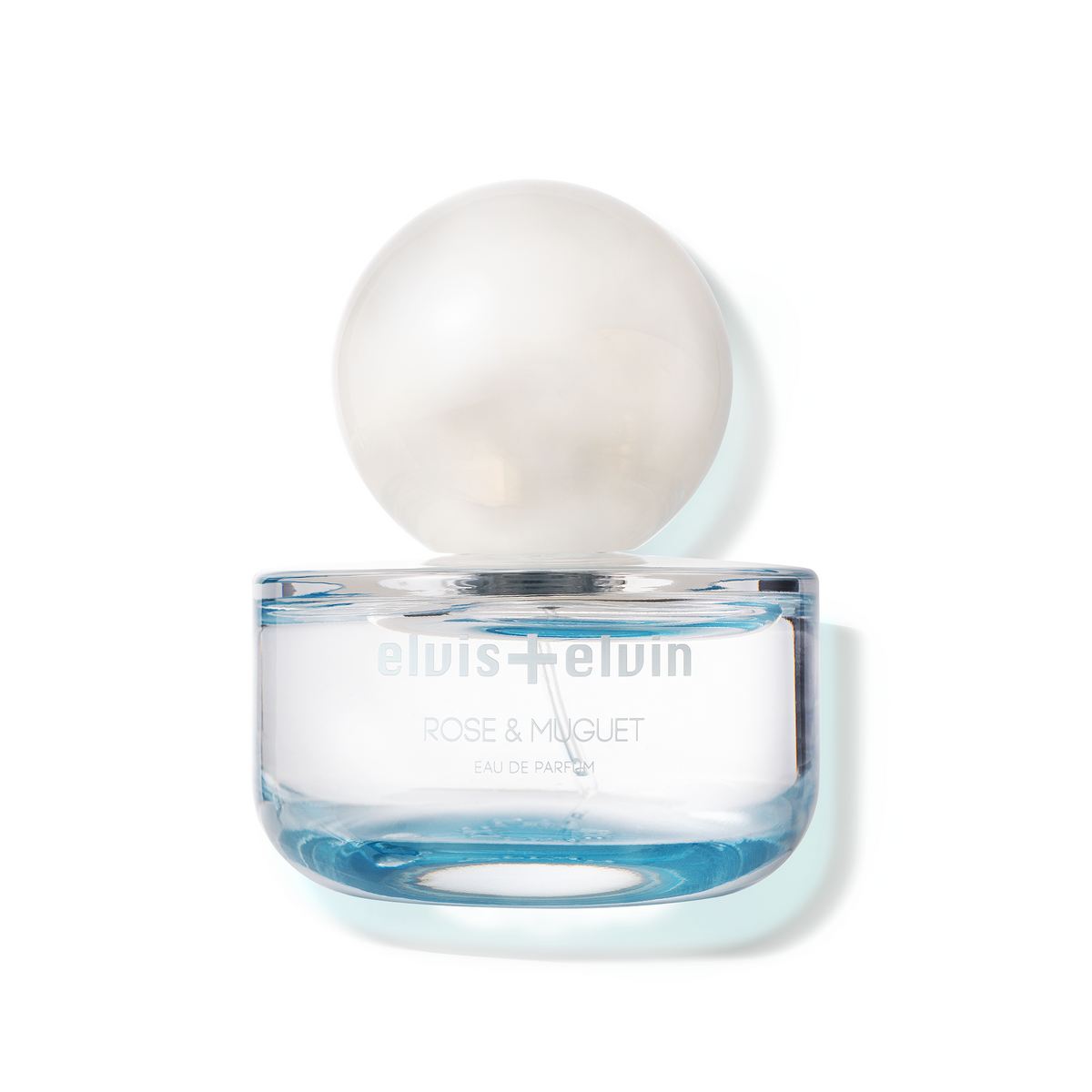 Rose & Muguet eau de parfum jar, clear cap, blue base; elvis+elvin label