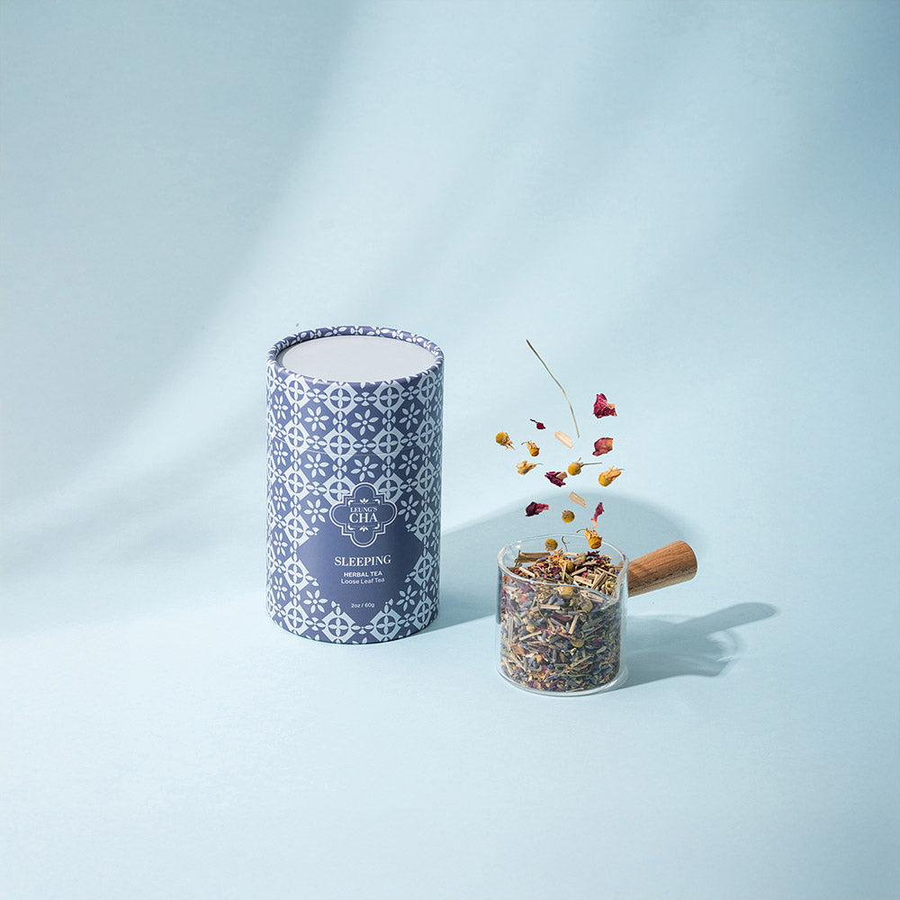 Blue sleeping herbal tea tin and small jar filled with dried tea leaves
