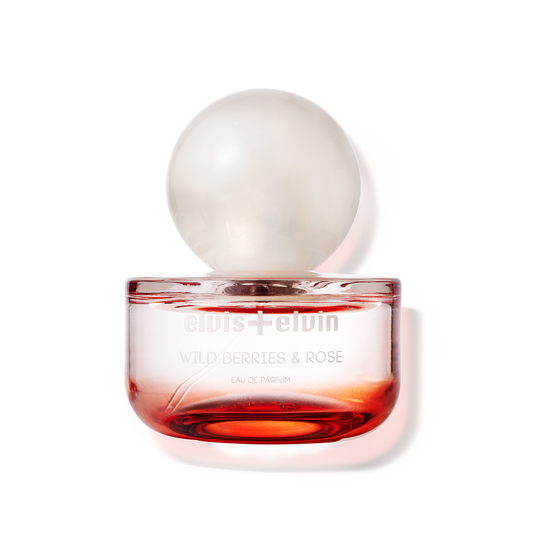 Wild Berries & Rose eau de parfum bottle, amber-pink glass with round cap