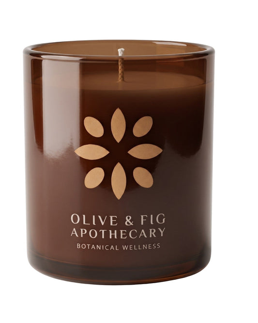 Amber glass jar candle with floral emblem and wood wick, unlit