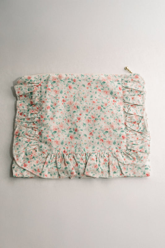 Pastel floral ruffle zip pouch with gathered front and zipper pull loop