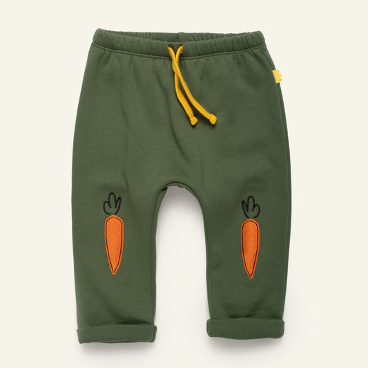Green baby jogger pants with embroidered orange carrot patches and yellow drawstring