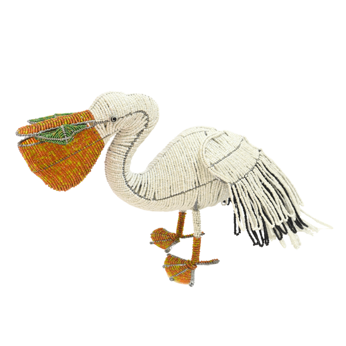 Pelican knit figurine with orange beak, green-and-yellow crest, and fringe wings on legs.