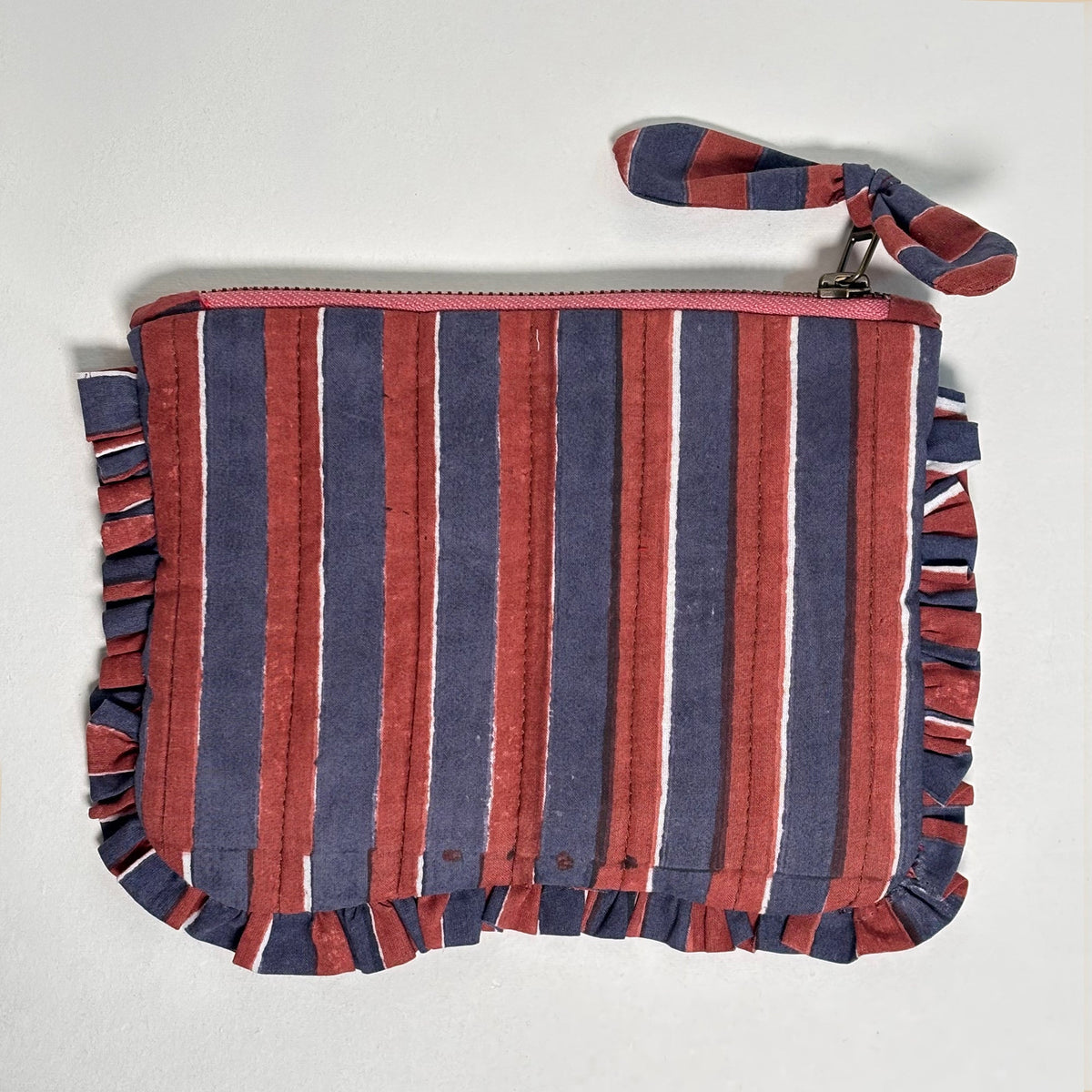Striped quilted cotton pouch with red-blue vertical stripes, frill edges, and zipper