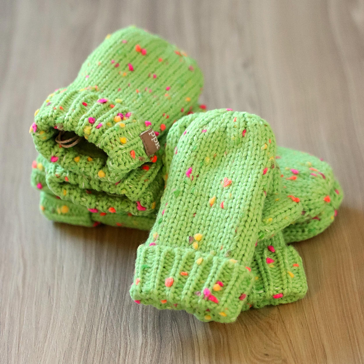 Kids' lime green speckled knit mittens with folded cuffs