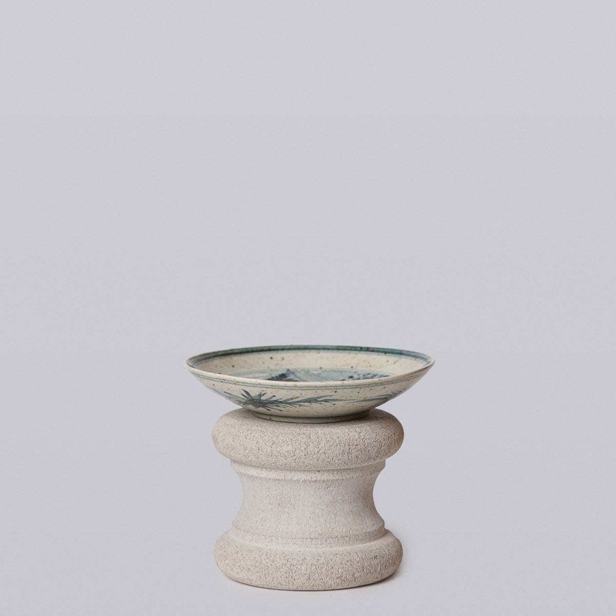 Small porcelain dish with blue-and-white crane motif, shallow bowl shape