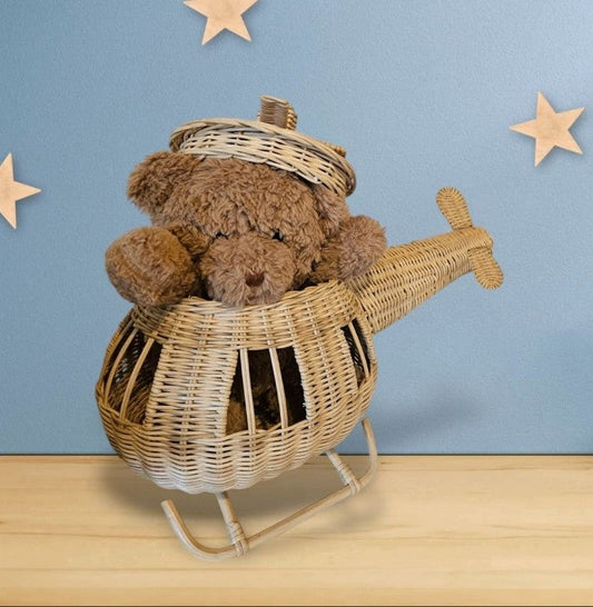 Woven rattan toy helicopter with a teddy bear tucked inside its cabin