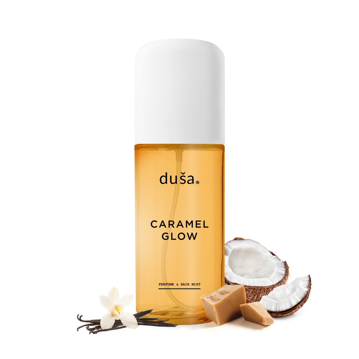 dusa Caramel Glow perfume mist bottle with coconut pieces and vanilla flower