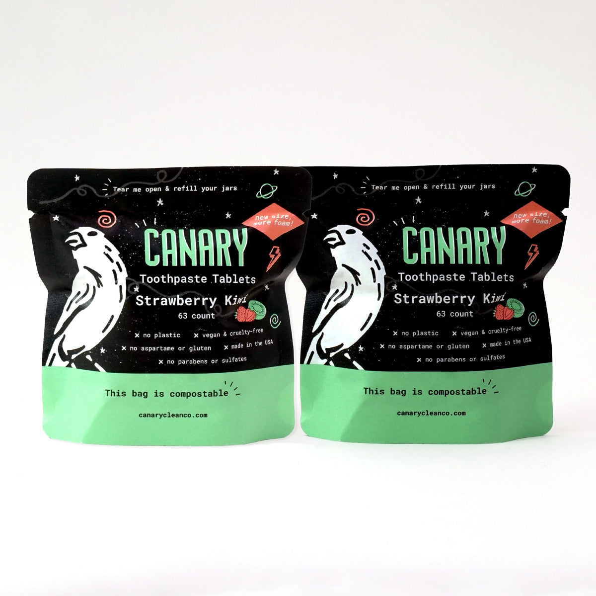 Two Canary Strawberry Kiwi toothpaste tablet pouches with black and green packaging