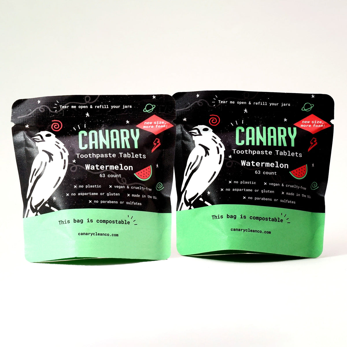 Two compostable refill pouches of Canary watermelon toothpaste tablets.