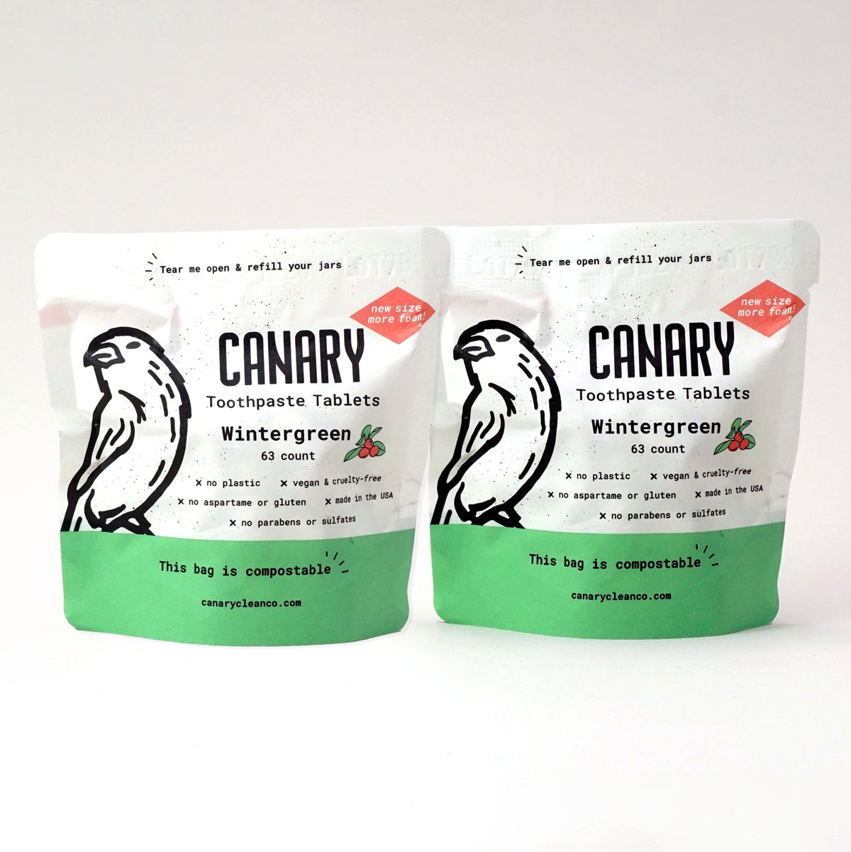 Canary Wintergreen toothpaste tablets in two compostable pouches with green lower panels.