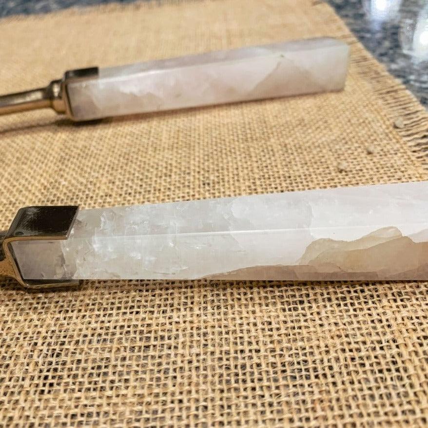 Rose quartz serving spoon with metal end cap and long pale pink stone handle