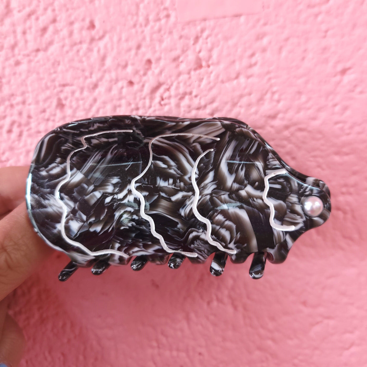 Ocean-themed hair claw with dark, white-outlined fish pattern