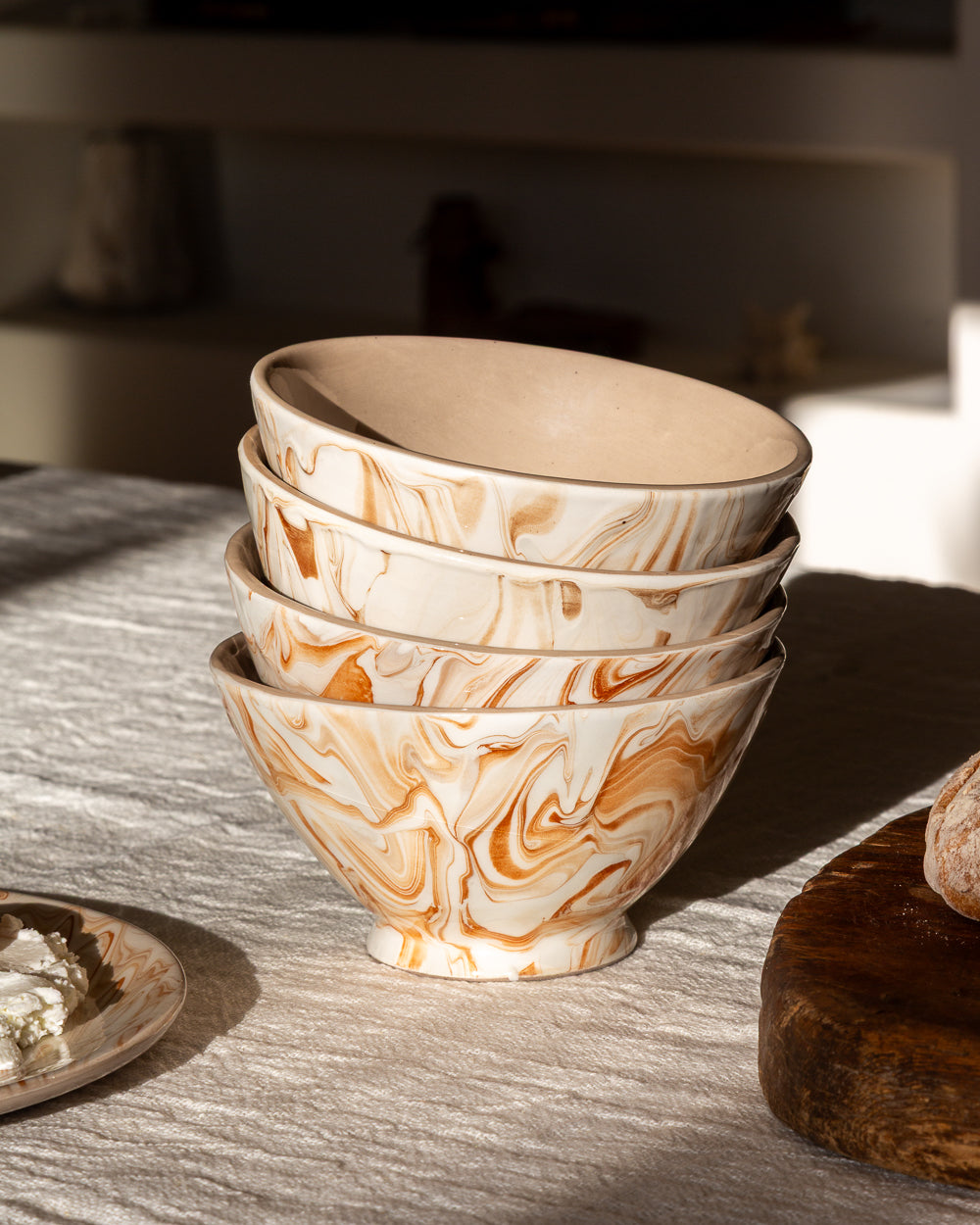 Marbled ramen bowls with orange swirl design, three stacked in a row
