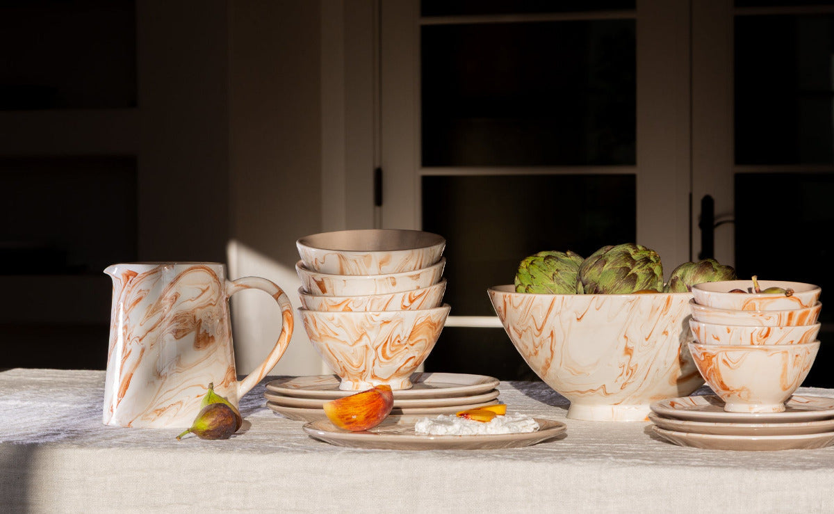 Marbled terra ceramic pitcher with molded spout, white and orange-brown swirl glaze