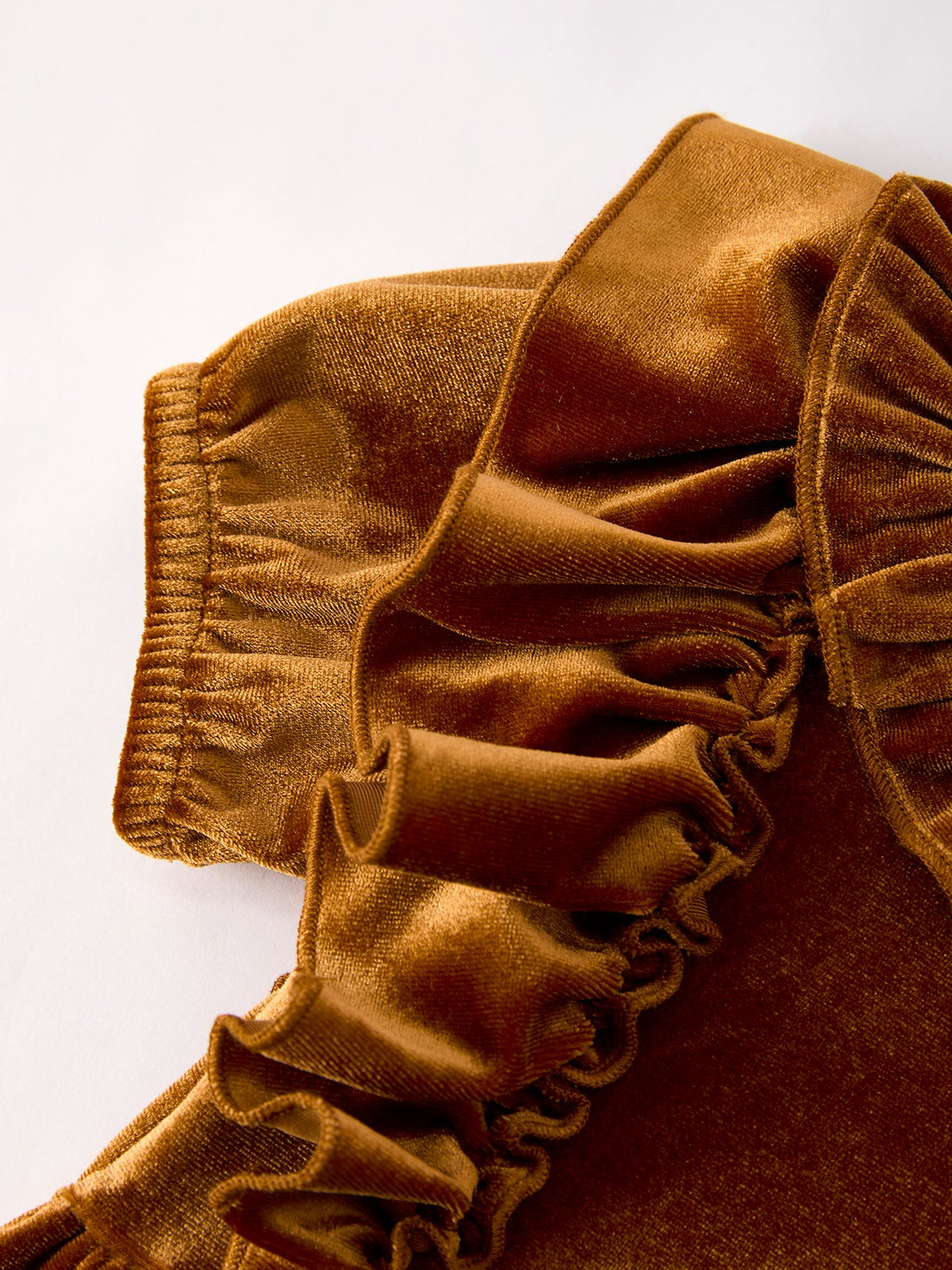 Girls velvet dress sleeve detail in brown-gold with gathered ruffle edging