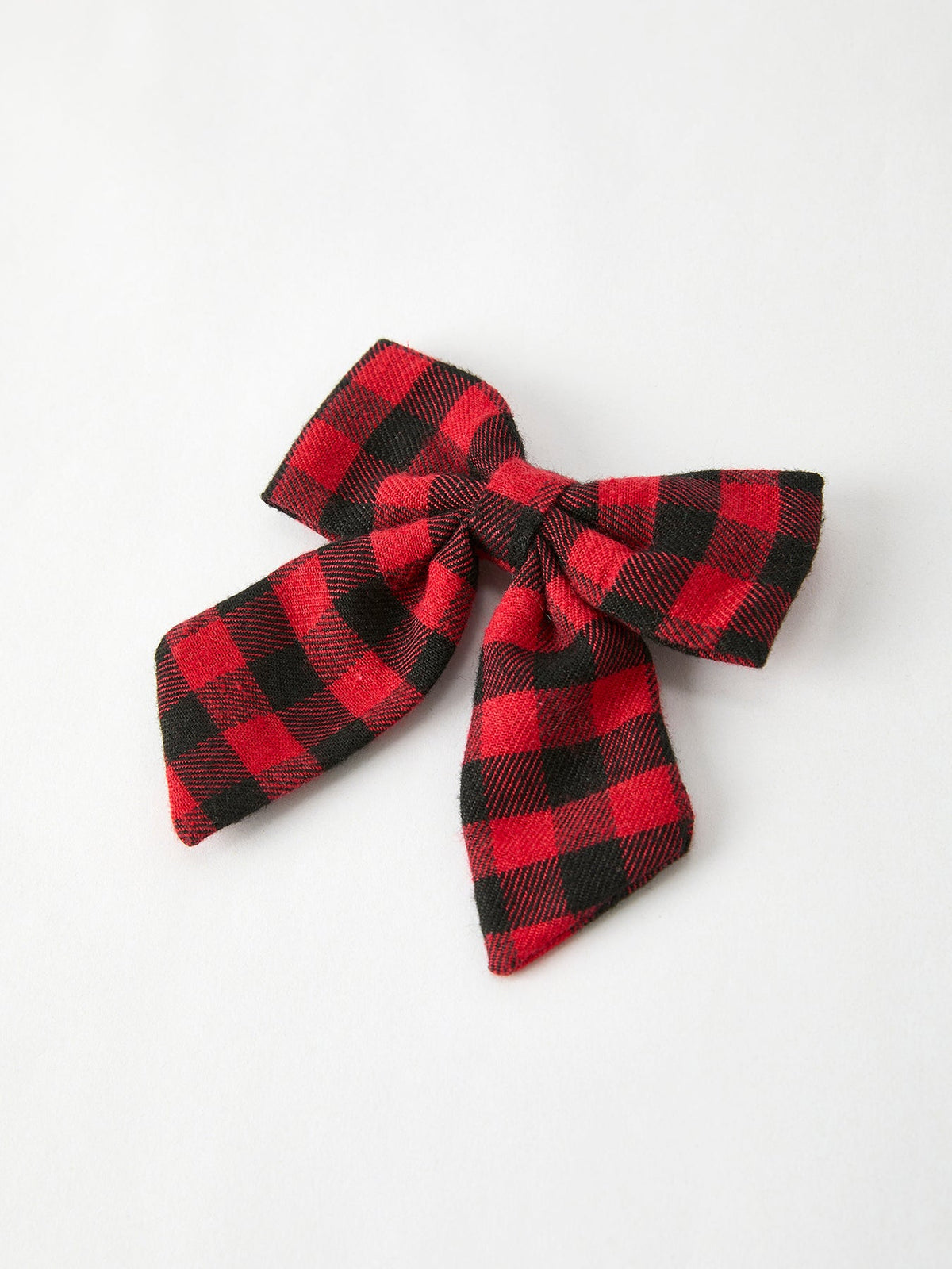 Red and black plaid bow hair clip with layered ribbon tails
