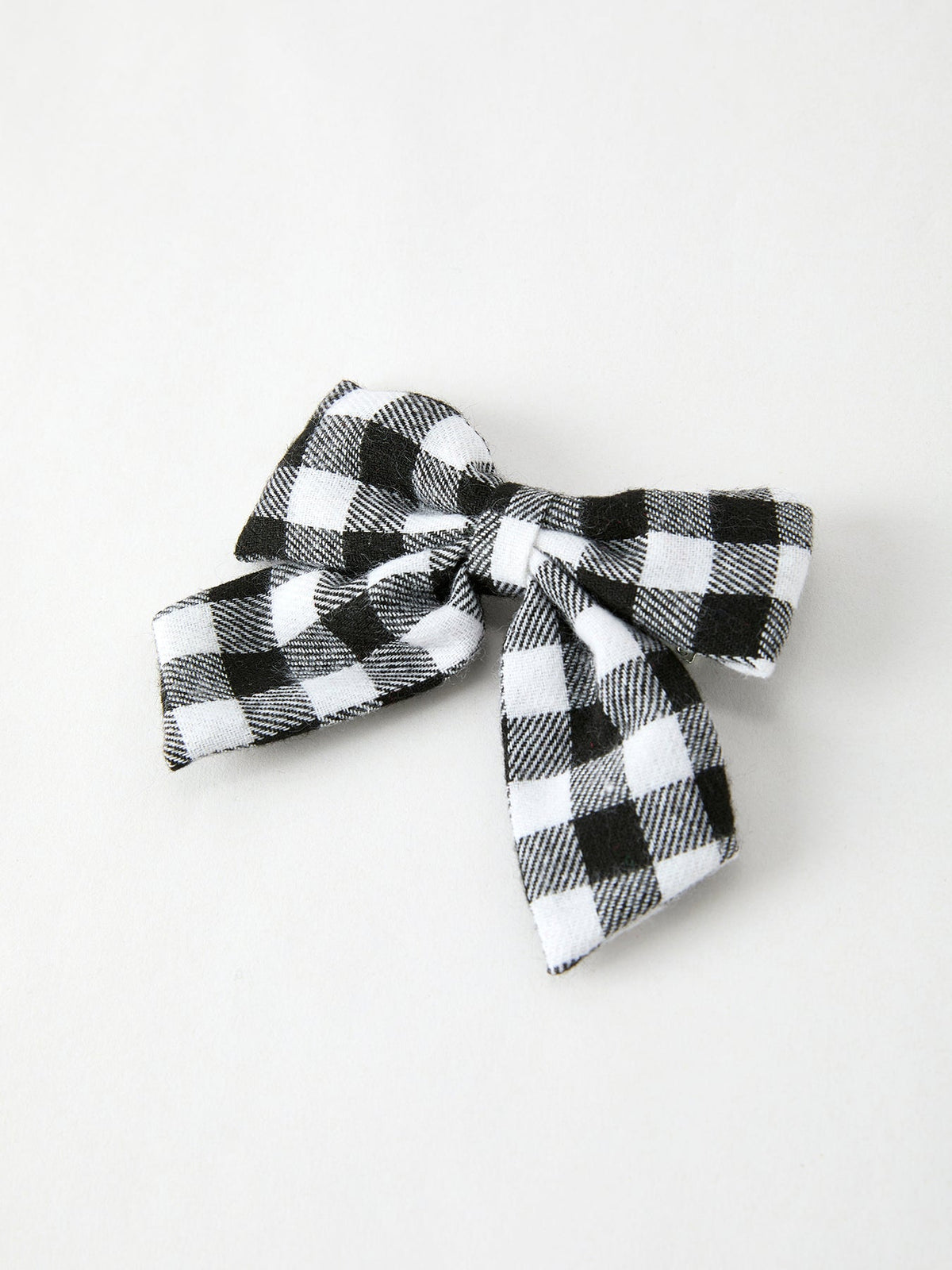 Black-and-white plaid bow hair clip with layered ribbon tails