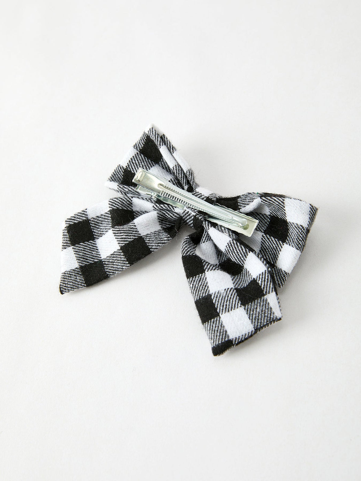 Black-and-white plaid bow hair clip with silver alligator barrette