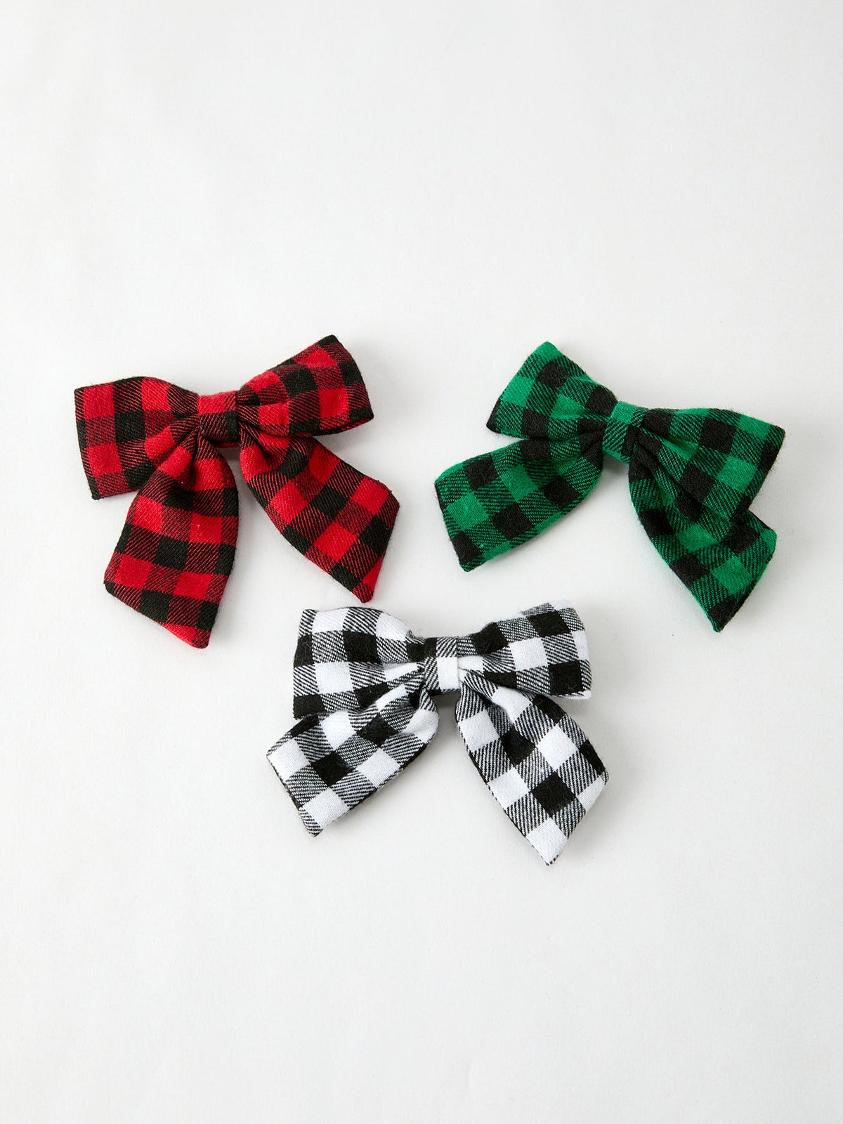 Plaid hair bow clips set: red, green, and black-and-white with bow knots