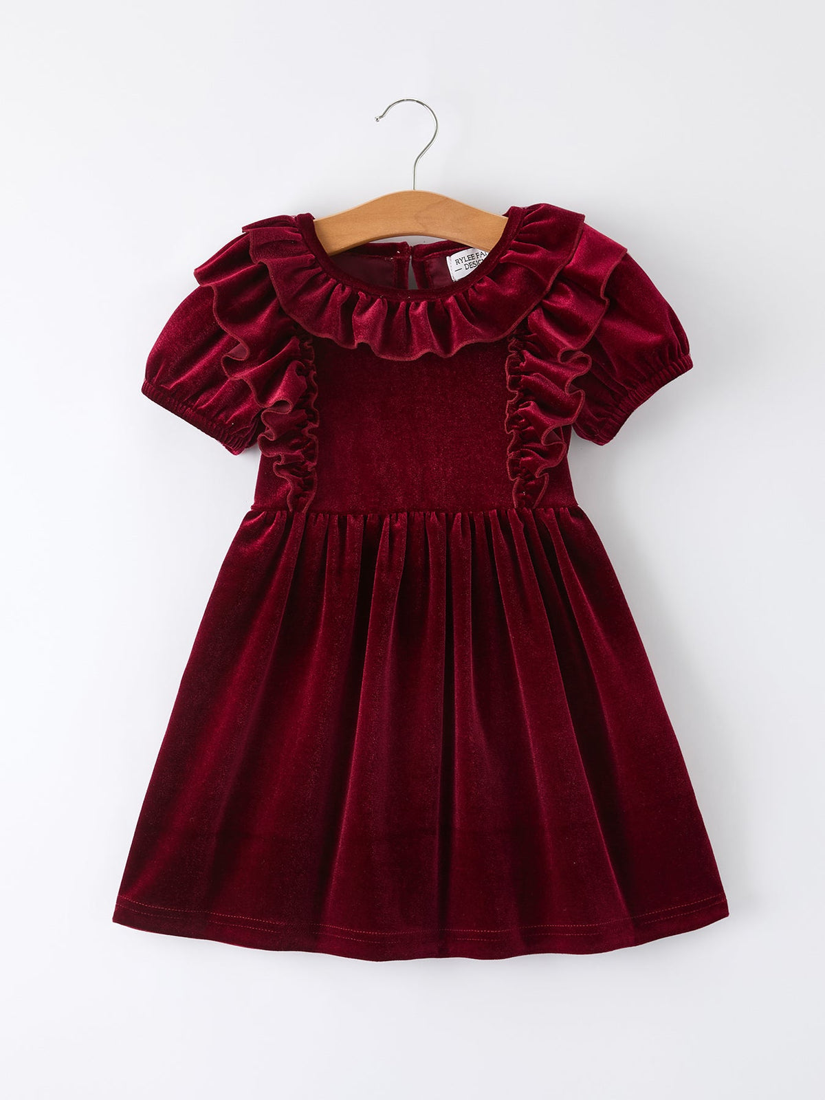 Girls velvet dress in burgundy with ruffled neckline and short puff sleeves