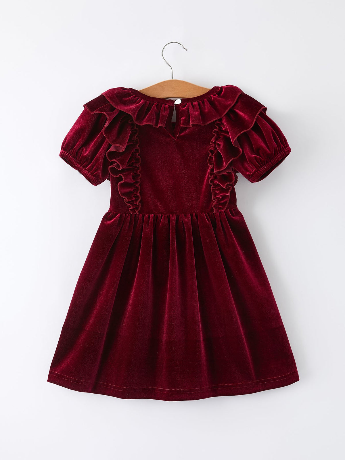 Girls velvet dress in burgundy with ruffled neckline and pleated skirt